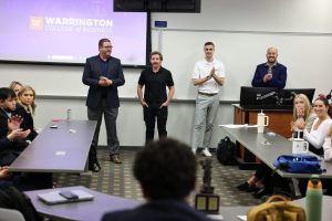Baker Hughes representatives present to a classroom.