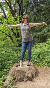 April Rowland poses on a rock.