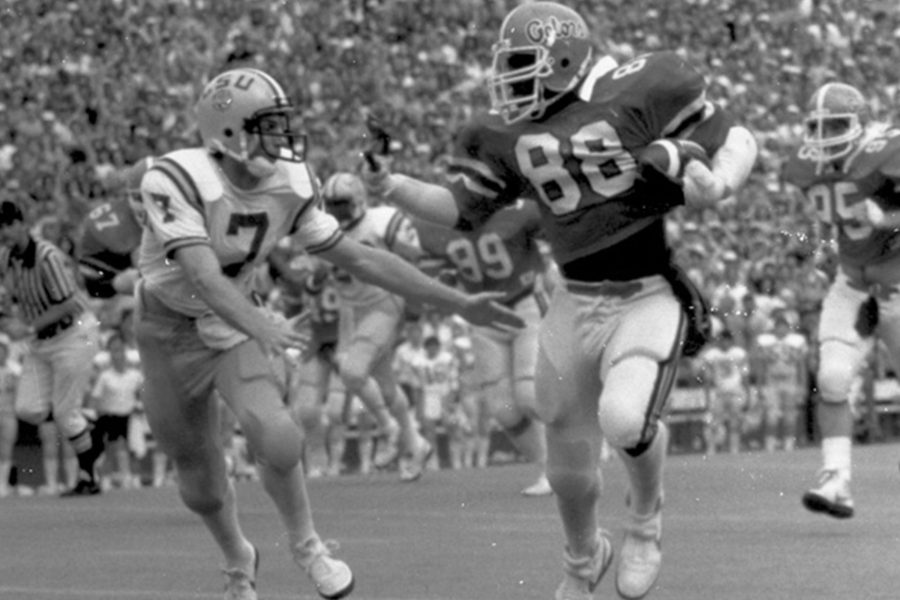 Two football players in motion on the field.