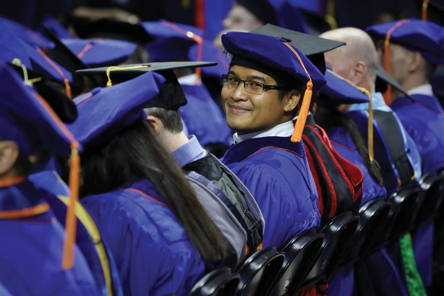 UF DBA student at graduation with his peers.