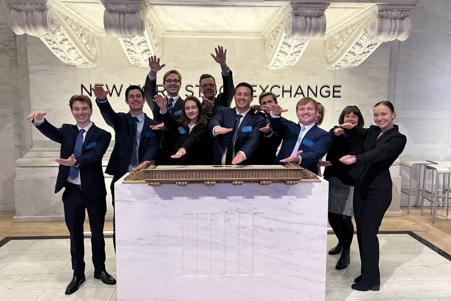 A group of students do the Gator Chomp at the New York Stock Exchange.