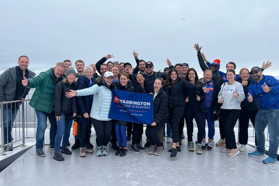 Warrington MBA students display a school banner in Oslo, Norway.