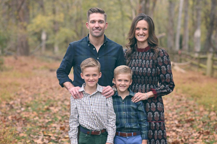 Michael Peerson and Sarah Peerson pose for a photo with their two sons, around ages 7-9.
