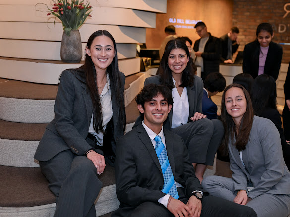 Belgrade Business International Case Competition Team sitting on stairs