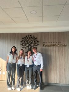 Four students on the Business and Management Case Competition team pose together for a photo