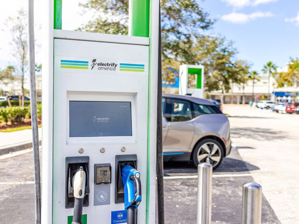 Electrify America EV charging stations in a store parking lot