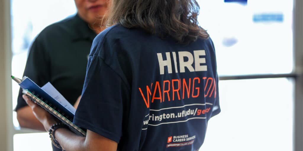 Recruiters from the Florida Auditor General speak with students at a career fair hosted by the Warrington College of Business.