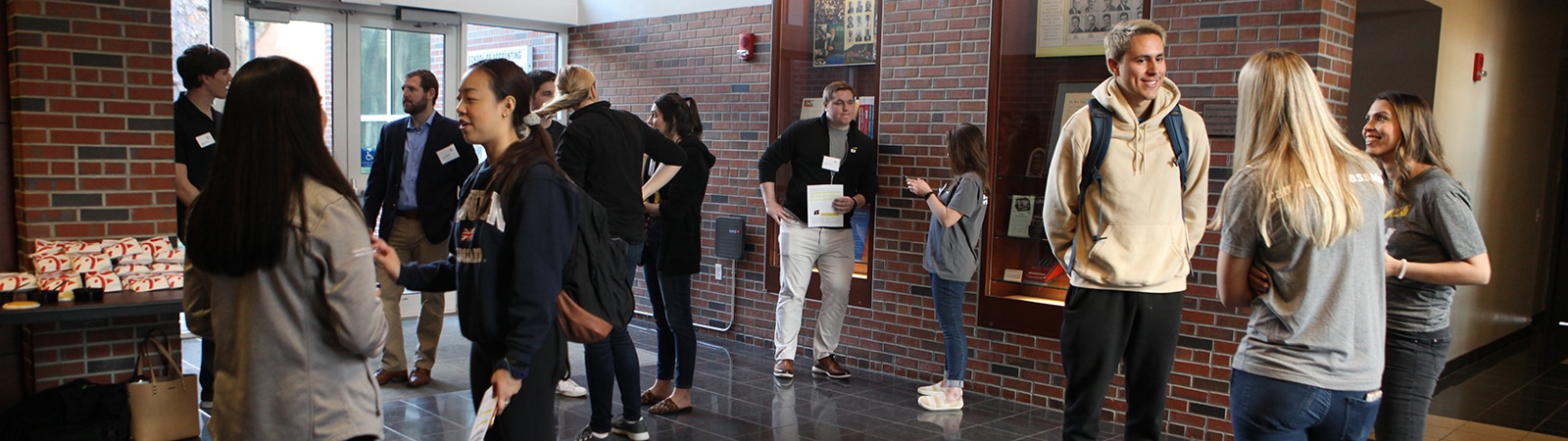 UF Warrington BS in Accounting students interact with recruiters in a common area in the Fisher School of Accounting