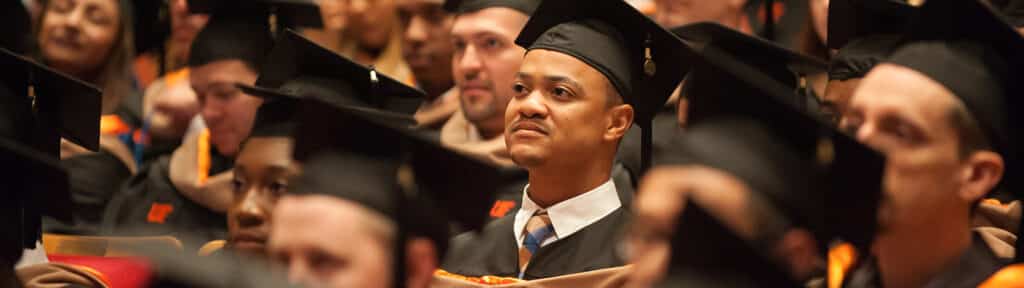 University of Florida Warrington College of Business joint MBA students wear caps and gowns during commencement