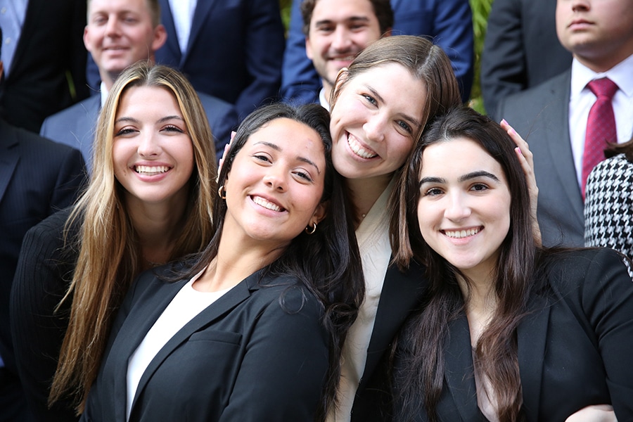 UF Warrington College of Business students participating in a joint master's degree program pose and smile