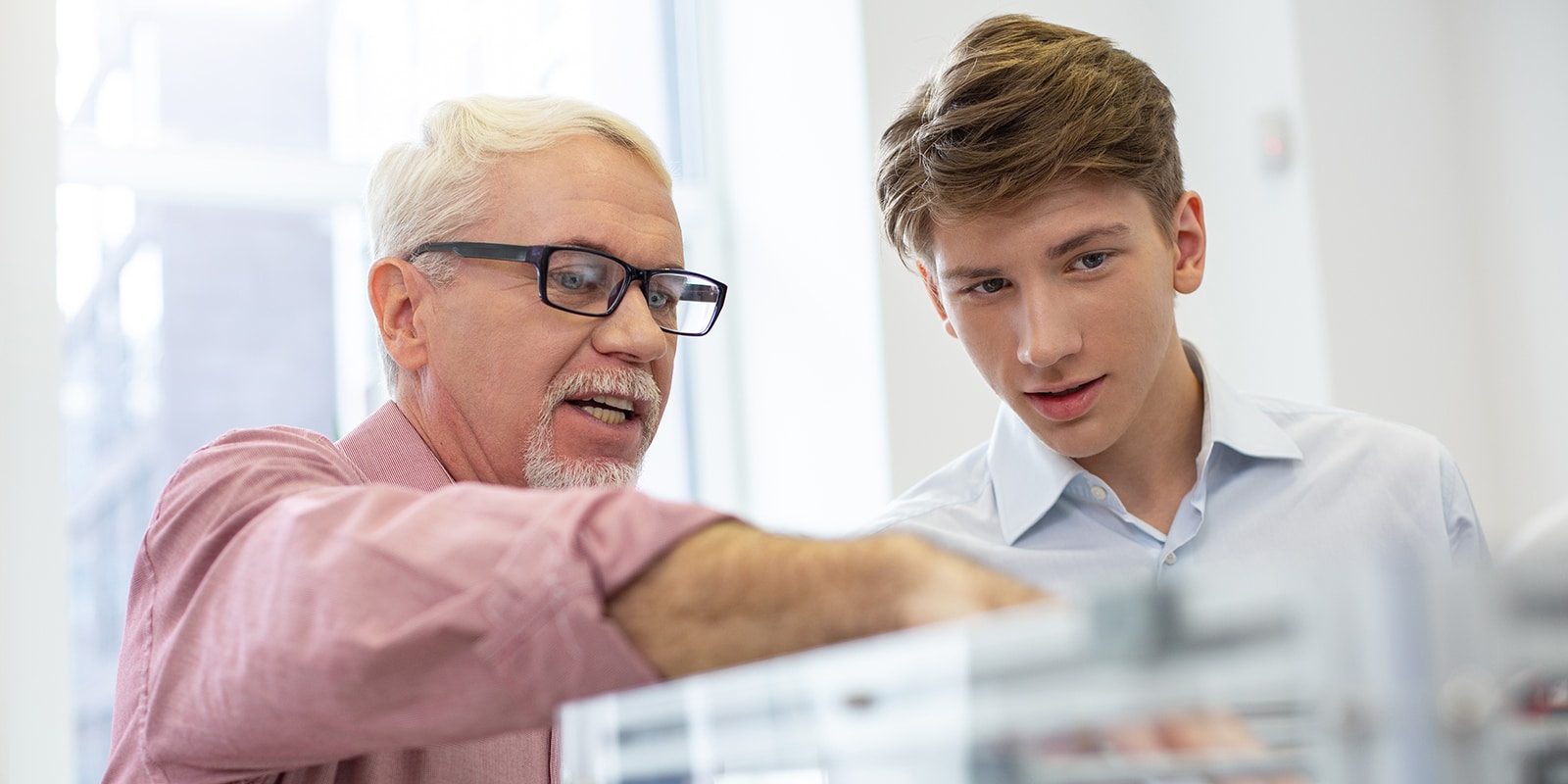 A sponsor discusses a project with a UF Warrington MS in ISOM - Information Technology student during a summer internship