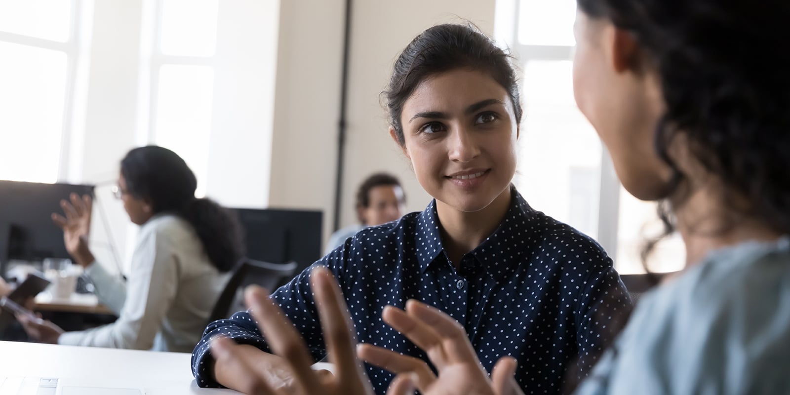 A student from UF Warrington's MS in ISOM - Supply Chain Management program has a conversation with a supervisor during a summer internship assignment
