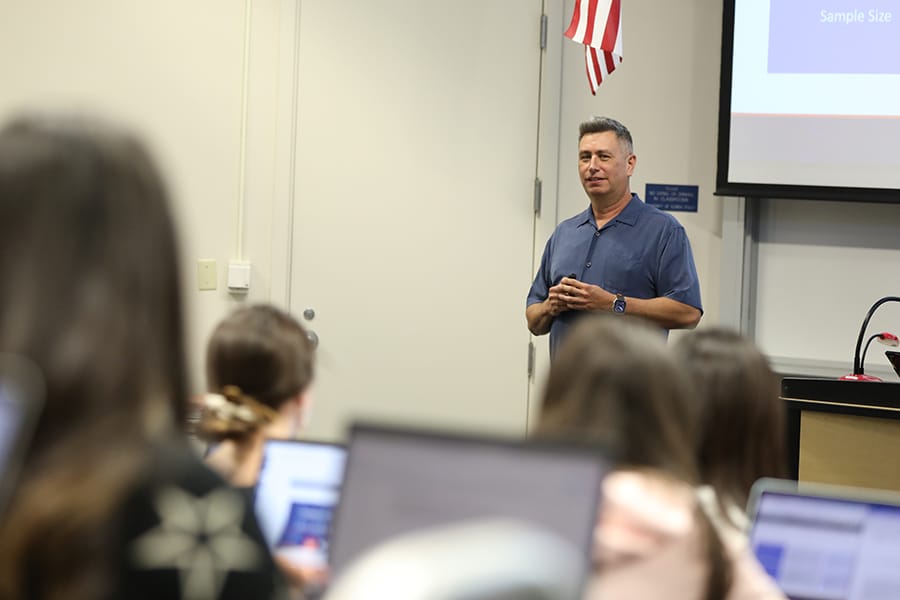UF Warrington Online MS Marketing Instructor Michael A. Carrillo speaks to a classroom of students