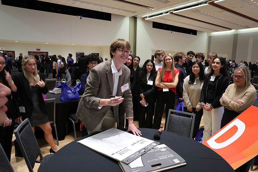 A student prepares to write on a large pad during an event for Entrepreneurship students at the University of Florida Warrington College of Business