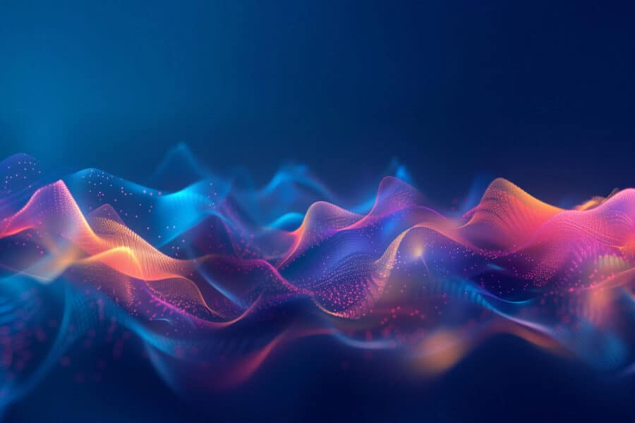 A graphic of blue, purple and orange waves with a digital speck textures