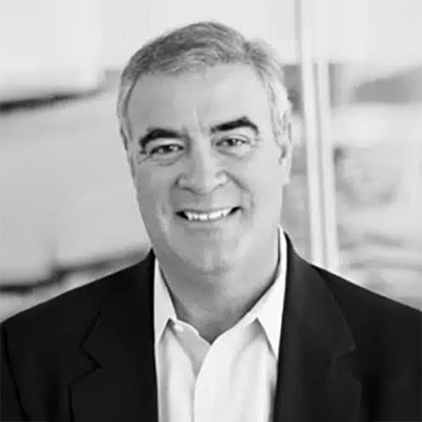 Black and white professional headshot of Bob Wordes, a man with salt-and-pepper hair, smiling and wearing a dark suit jacket and white collared shirt.