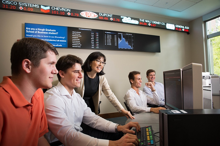 Students working in UF's Capital Markets Lab in Hough Hall. 