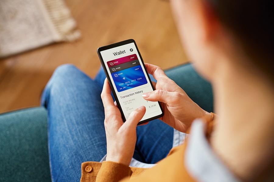 Woman checking digital wallet on smartphone.