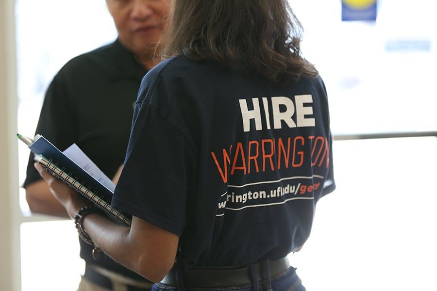 The back of a student's HIREWarrington shirt.