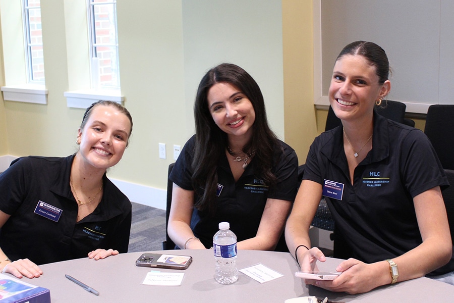 Students around a table in the Heavener Leadership Challenge. 