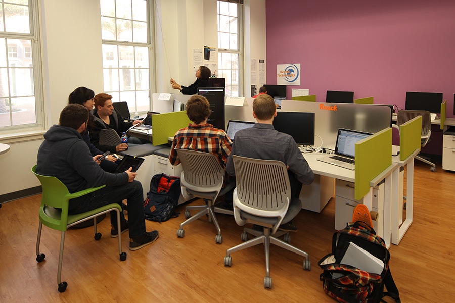 Students in dedicated cubicle spaces. 