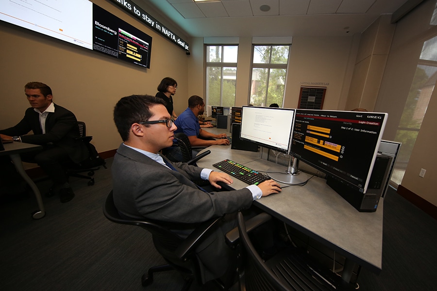 Students working in UF's capital markets lab.