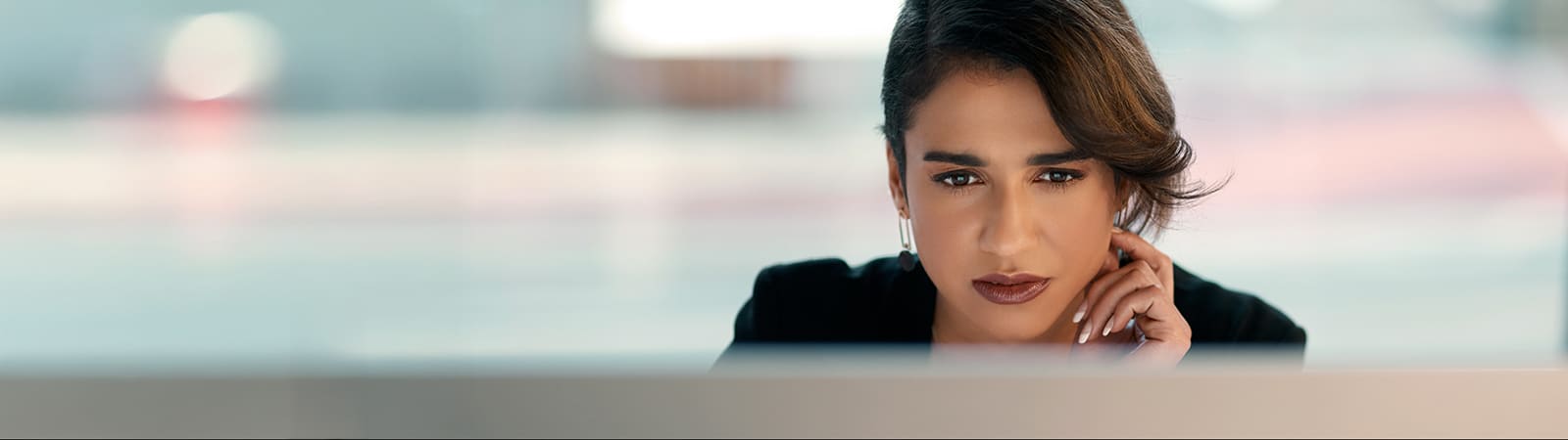 A student looks at a computer monitor with coursework for the University of Florida Warrington College of Business' MS in Business Analytics program