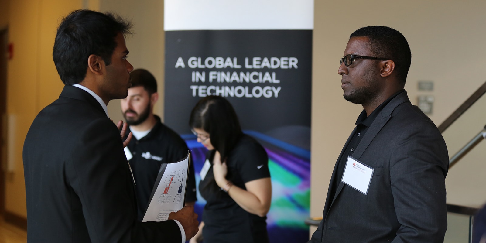 A student from UF Warrington's Online MS in Business Analytics program meets with a recruiter during a career fair