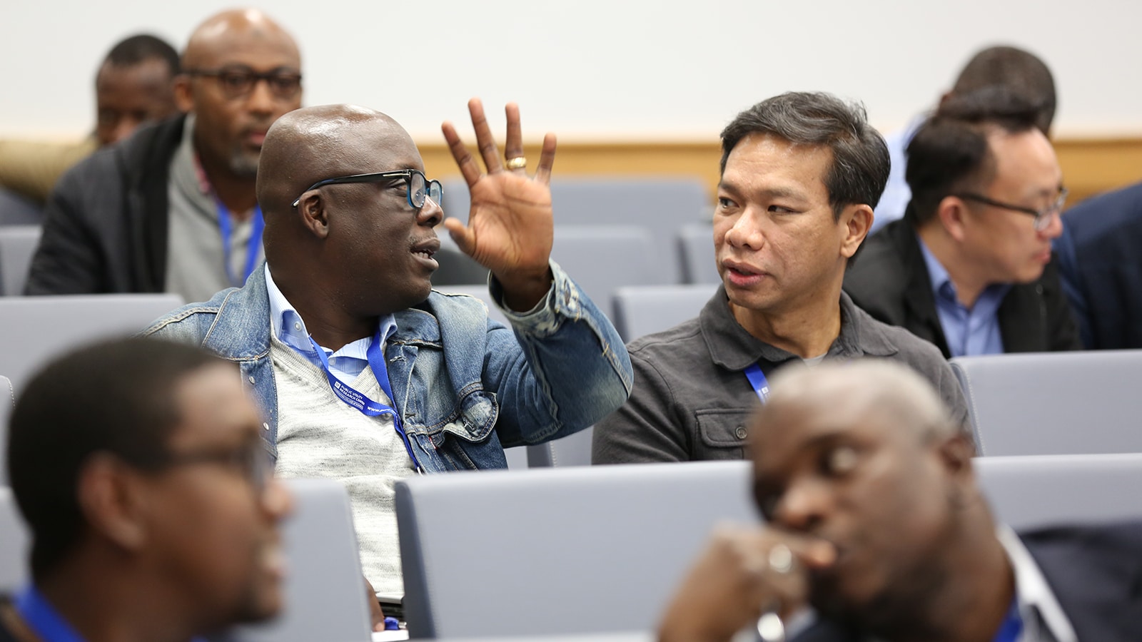 Audience member speaking candidly during a PURC training event.