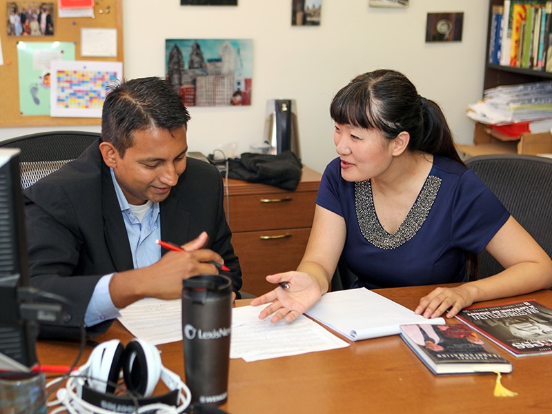 A PhD student working with their faculty advisor.