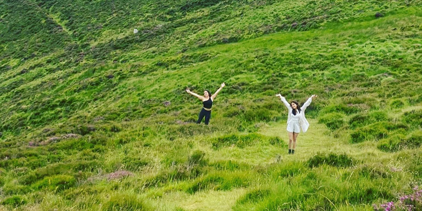 Two students standing in the hills of Dublin, Ireland.