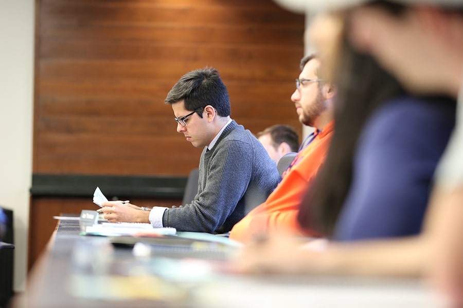 Student reviewing paper in class. 
