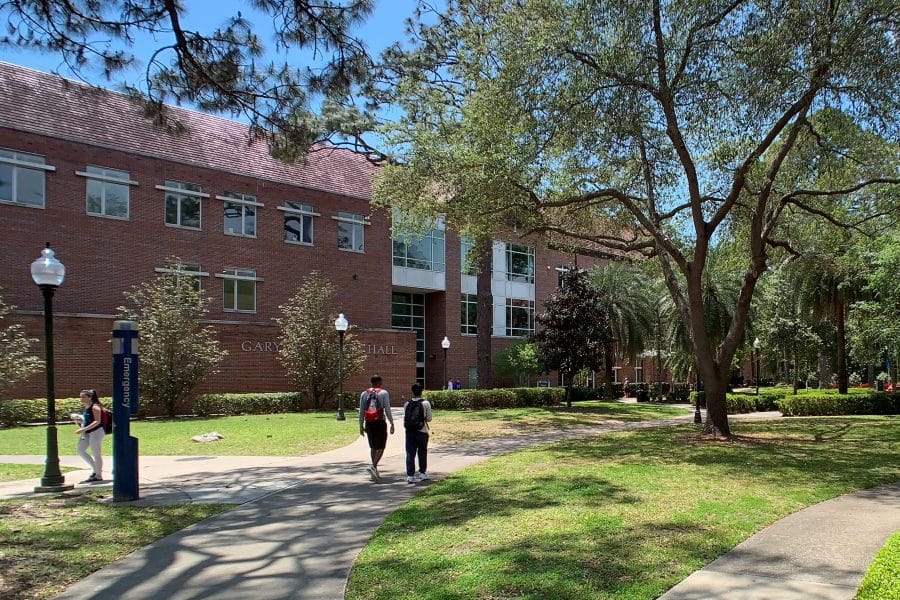 Photo of Gerson Hall during a sunny day with students walking around outside
