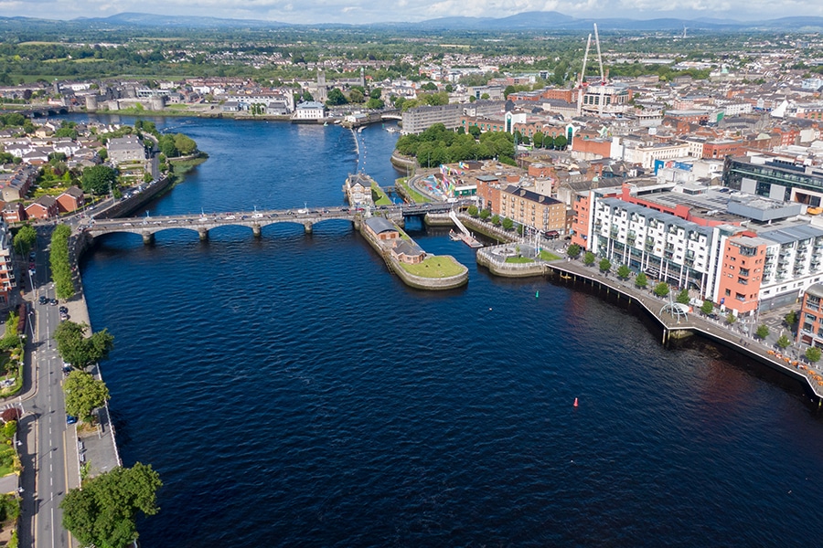 Limerick today, seen from a bird's eye view, a colorful and beautiful city with the River Shannon flowing through it.