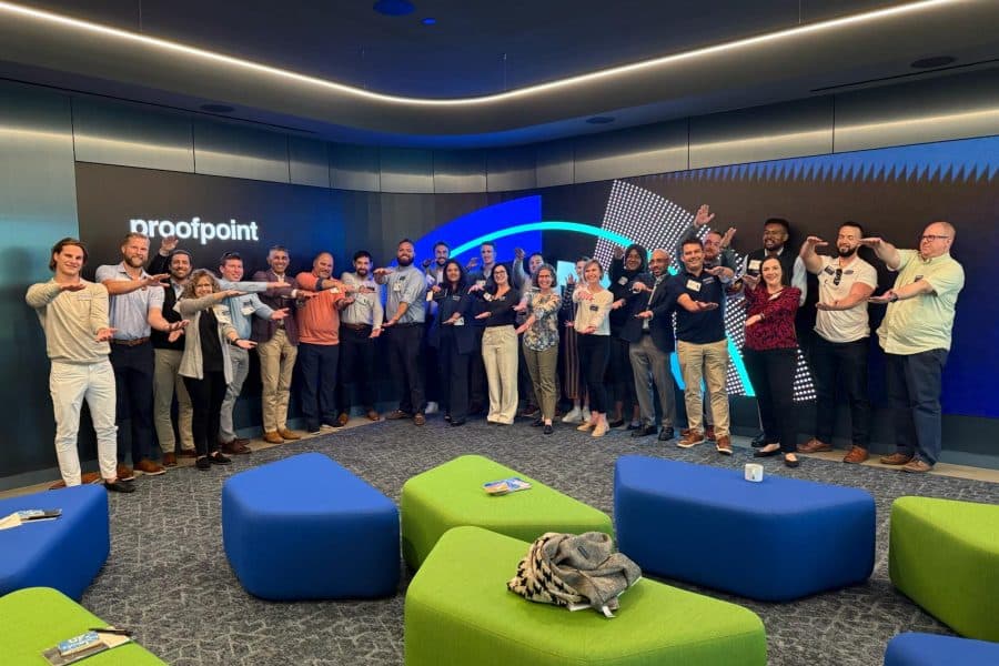 A large group of students do the Gator Chomp at Proofpoint's corporate offices.
