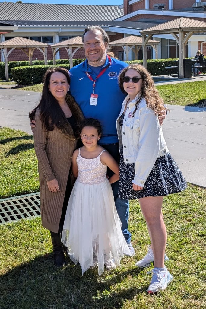 Jesse Eisner and his wife and two daughters post for a family photo. 
