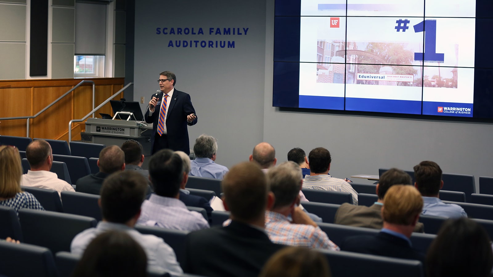 Dr. Tim Becker speaking to an audience. 