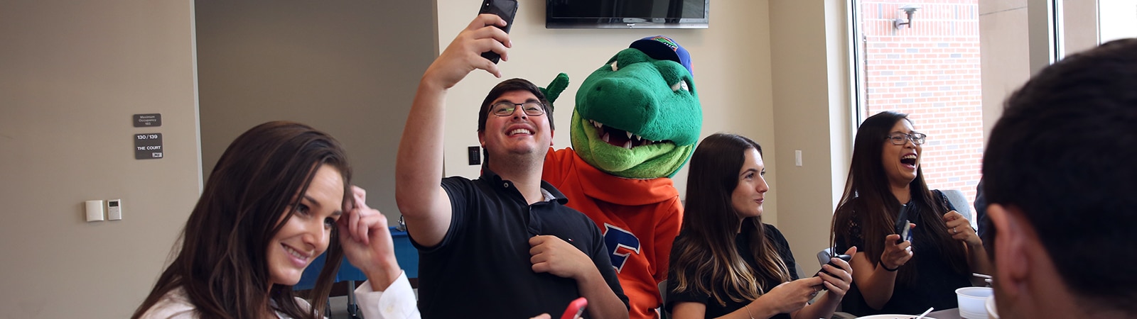 Happy students at an event with Albert Gator. 
