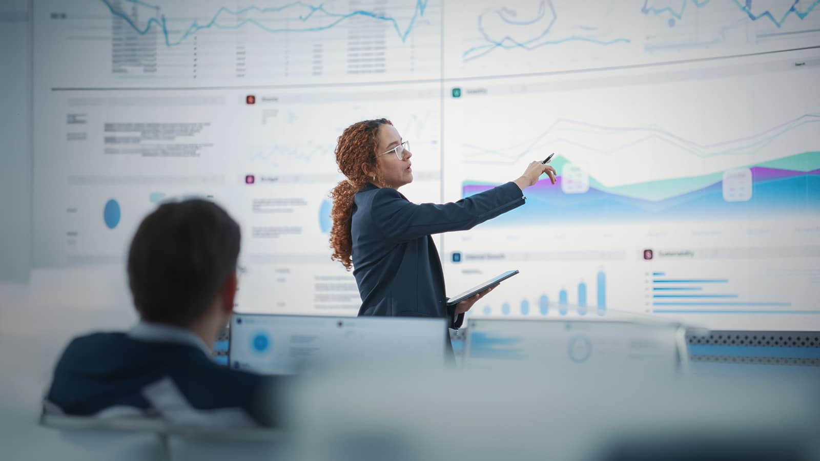 Hispanic Female Senior Data Scientist Reviewing Reports.