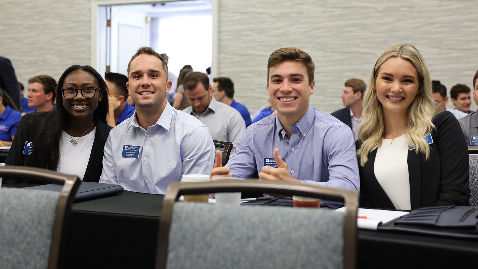 Smiling students at the ISOM orientation. 