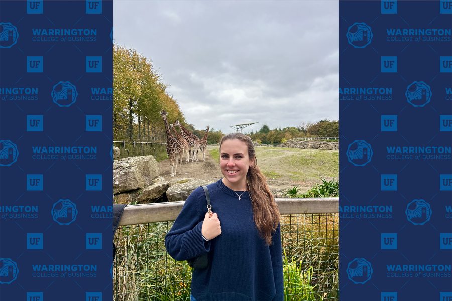 MIB student Carly Rutigliano smilling in front of giraffes
