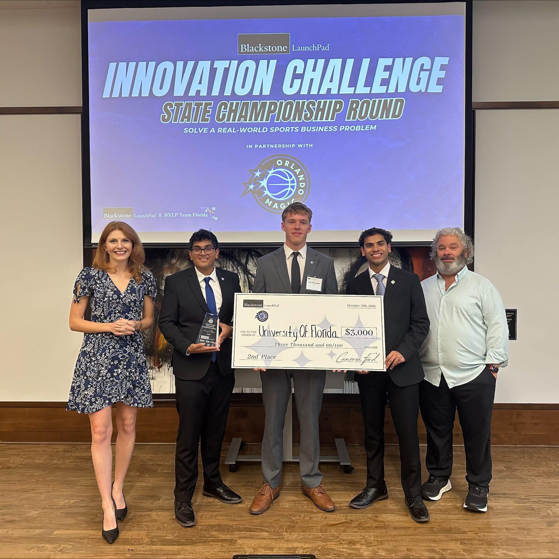 Tyler Rasmussen, Ahan Soni and Archit Namboodiri holding big $3,000 check 