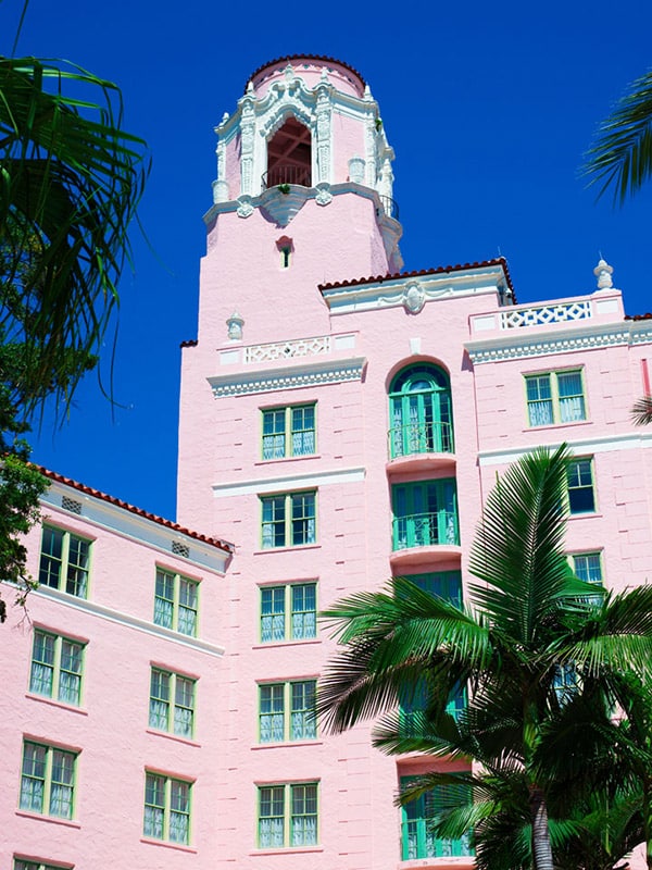 The historic Vinoy stands tall in pink with white and turquoise trim.