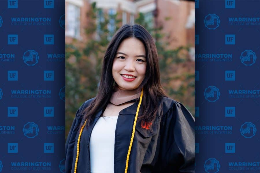 Ruijiao "Rachel" Xu poses facing the camera in her graduation regalia.